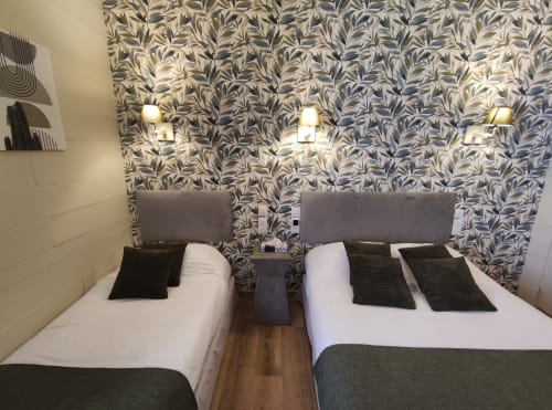 Triple bedroom at Le Pavillon Saint Martin Hotel in Souillac with twin and double beds, botanical wallpaper