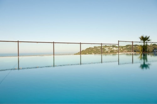 Infinity pool at Al Mirador Resort in Fasano overlooking coastal cliffs and Mediterranean sea
