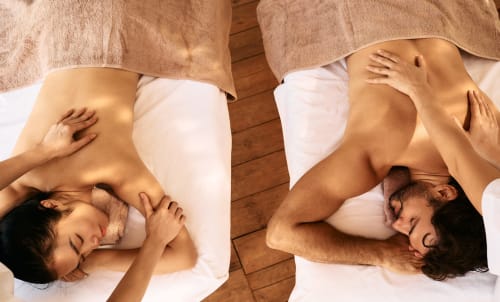 Couple relaxing together on bed at Al Mirador Resort in Fasano, Italy