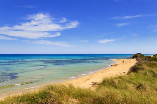Pristine sandy beach with turquoise waters at Al Mirador Resort in Fasano, Italy