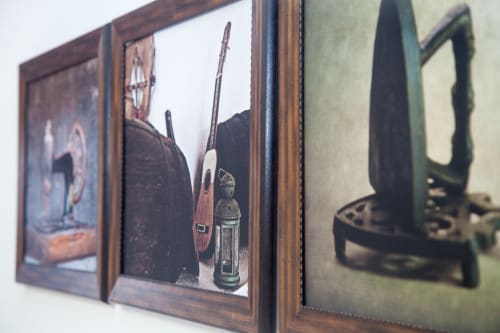 Western-themed framed artwork display with rifles and vintage items at Finca de La Geria cottage in Yaiza