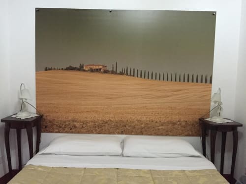 Tuscan villa bedroom at Il Casale di Nanni with countryside landscape headboard featuring cypress trees and rolling fields