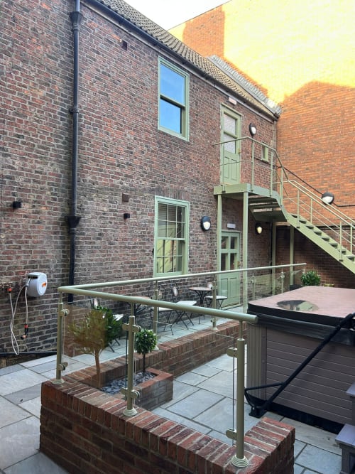 Bridge Street Apartments | Accommodation | Tub | Stairs | Wall | Chairs and tables | Window | Door