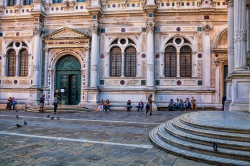 Historic Venetian palace facade with green door and arched windows, San Firmino Residenza in Venice
