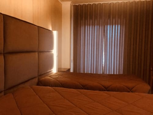 Bed of Twin Room with Balcony at Hotel Europa 
