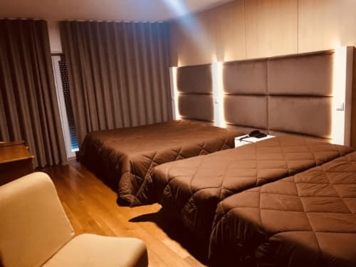 Bed of Family Room with Balcony at Hotel Europa 