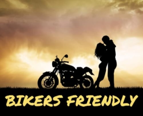Silhouette of couple embracing by motorcycle at sunset, romantic biker getaway in Nouvelle-Aquitaine