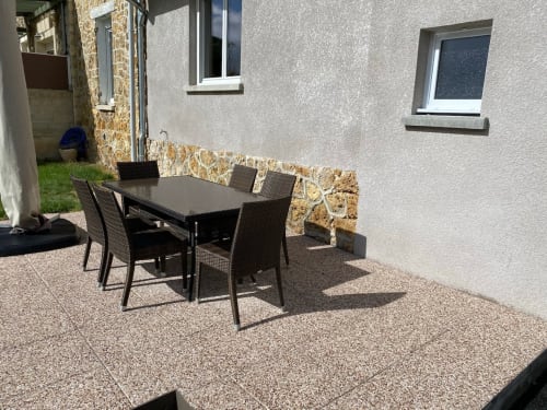 Private garden retreat, vacation rental with outdoor space, holiday home with a terrace, lush green garden stay, nature escape accommodation.