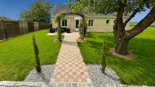Private garden retreat, vacation rental with outdoor space, holiday home with a terrace, lush green garden stay, nature escape accommodation.