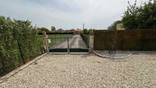 Private garden retreat, vacation rental with outdoor space, holiday home with a terrace, lush green garden stay, nature escape accommodation.
