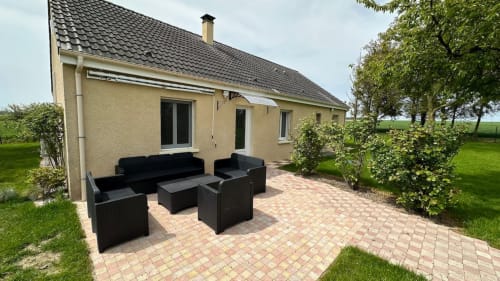 Private garden retreat, vacation rental with outdoor space, holiday home with a terrace, lush green garden stay, nature escape accommodation.