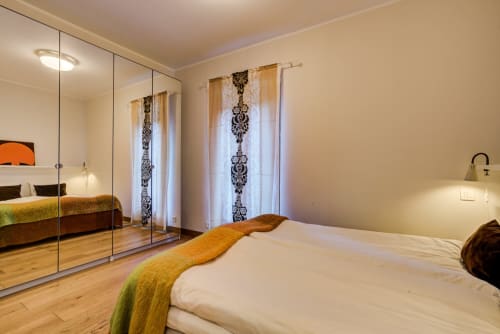 Bedroom with big mirror | Our Rooms and Apartments – Comfort and Elegance in the Heart of Chamonix
