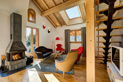 Living area with fireplace | Penthouse Apartment – ​​Luxury and Exceptional Panorama