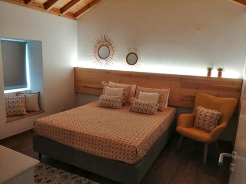Spacious bed and bed side chair | Relax and Unwind in Ti Chôa - Casa da Mata