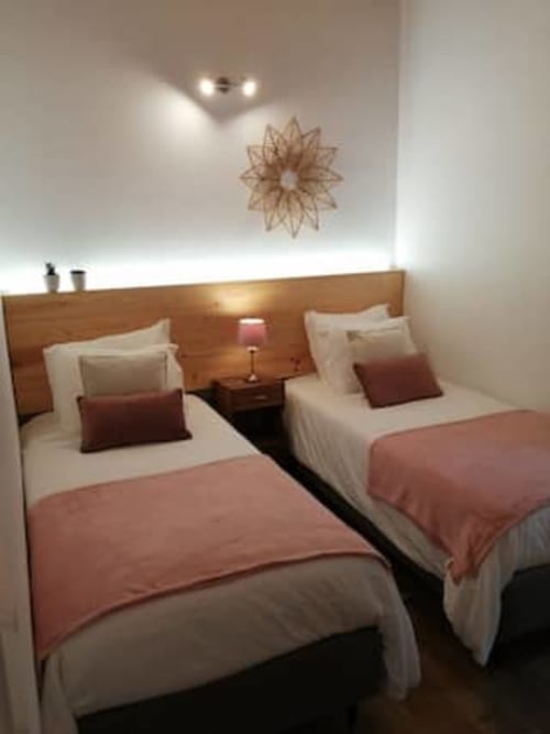 Two comfortable beds | Delight in the Charm of Ti Chôa - Casa do Biscoitinho