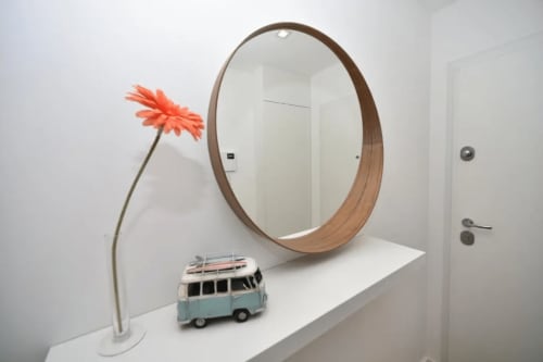 Round mirror of the apartment | Unwind in Our Stunning Apartment with Breathtaking Sea Views