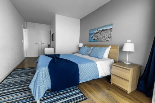 Room with spacious bed | Unwind in Our Stunning Apartment with Breathtaking Sea Views