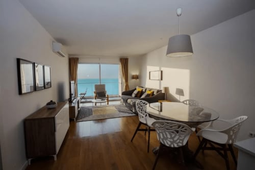 Spacious living area of the apartment with sea view | Unwind in Our Stunning Apartment with Breathtaking Sea Views