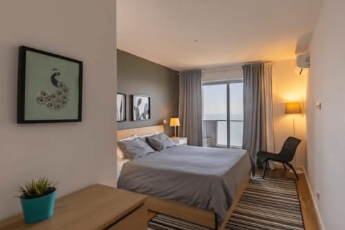 Room with spacious bed | Unwind in Our Stunning Apartment with Breathtaking Sea Views