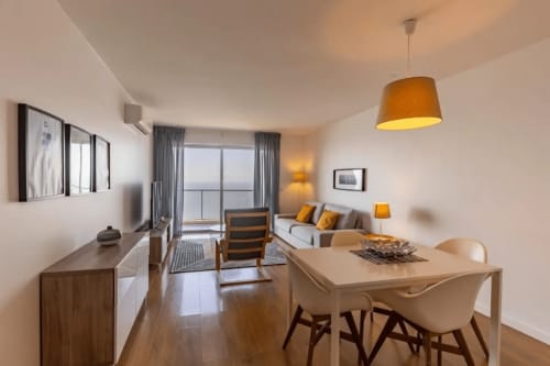 Dining and living area of the apartment | Unwind in Our Stunning Apartment with Breathtaking Sea Views