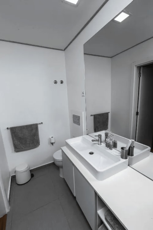 Bathroom with sink | Unwind in Our Stunning Apartment with Breathtaking Sea Views

