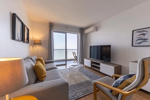 Living room with view | Unwind in Our Stunning Apartment with Breathtaking Sea Views