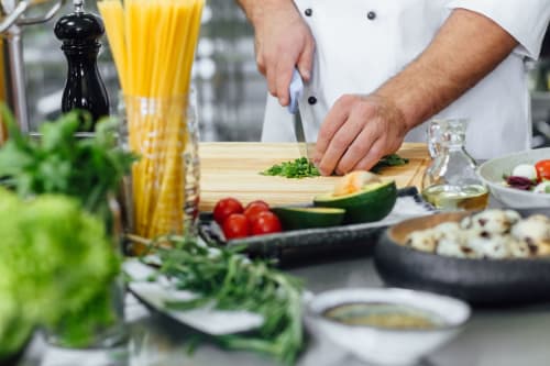 Chef prepares fresh vegetables at La Maison D'ambrine, a Chamaret French bed and breakfast