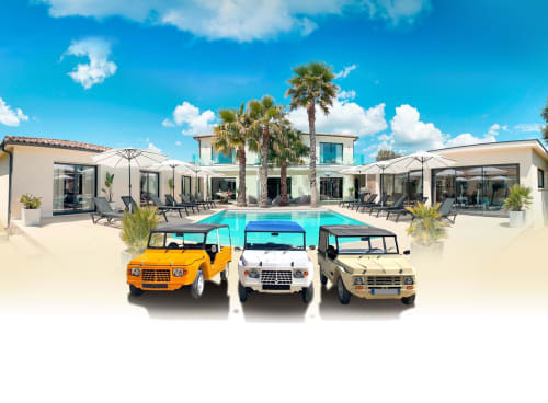 La Maison D'ambrine luxury villa in Chamaret with pool, palm trees, and vintage safari vehicles