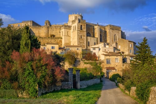 Medieval stone castle with tower in Chamaret, France, La Maison D'ambrine B&B surrounded by autumn gardens