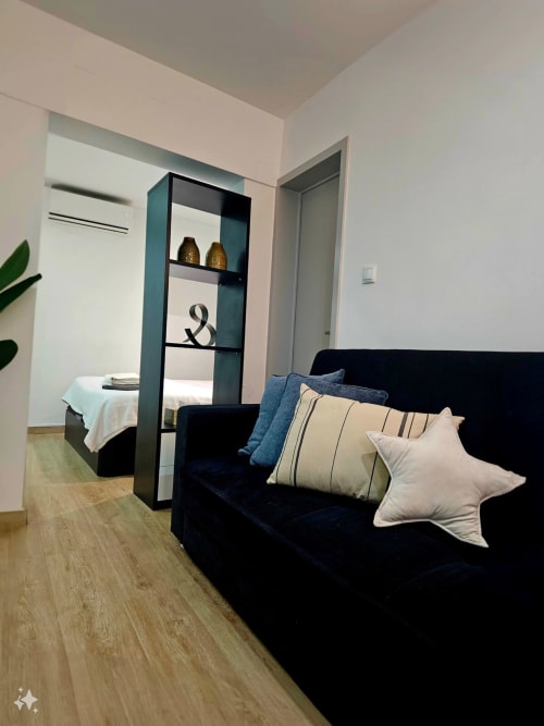 Comfortable sofa with pillows | Modern Comfort in the Bustling City Center