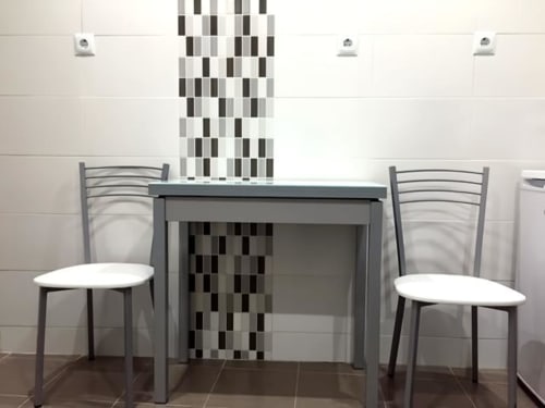 Table and chairs | Modern Comfort in the Bustling City Center