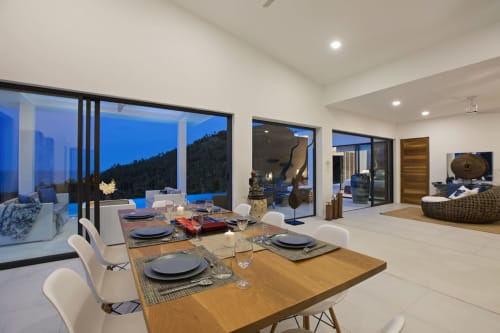 Long dining table with a stunning view | Experience Breathtaking Sea Views at Villa Indigo
