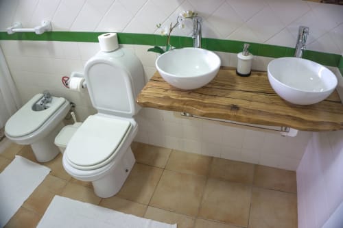 Bathroom with two sink, and toilet | Casa da Pedrosa: Your Ideal Retreat in Ponte de Lima, Portugal