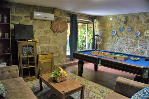 Entertainment area inside the house showing billiard, and board games | Casa da Pedrosa: Your Ideal Retreat in Ponte de Lima, Portugal