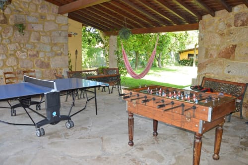 Tables games such as table tennis and table football outside the house | Casa da Pedrosa: Your Ideal Retreat in Ponte de Lima, Portugal