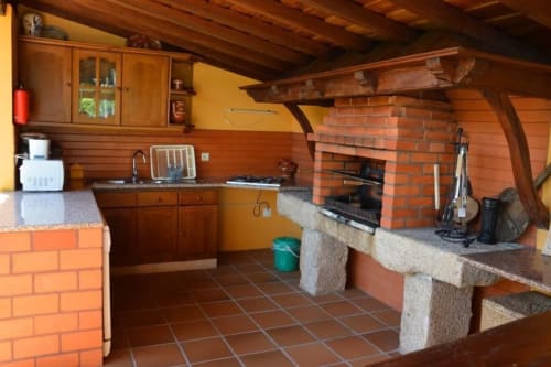 Outside kitchen of the house | Casa da Pedrosa: Your Ideal Retreat in Ponte de Lima, Portugal