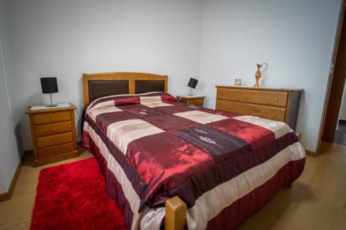 Comfortable bed with cabinet drawers | Welcome to Casa Rural "A Escola" – Your Tranquil Retreat in Pampilhosa da Serra