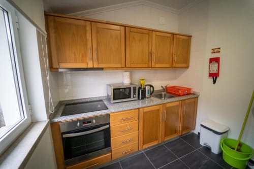 Kitchen with appliances | Spacious and Cozy: Triple Room with Private Bathroom