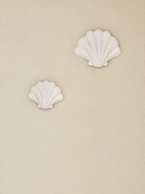 Two white decorative seashell wall ornaments in Hôtel Maison Richet suite, Les Sables-d'Olonne