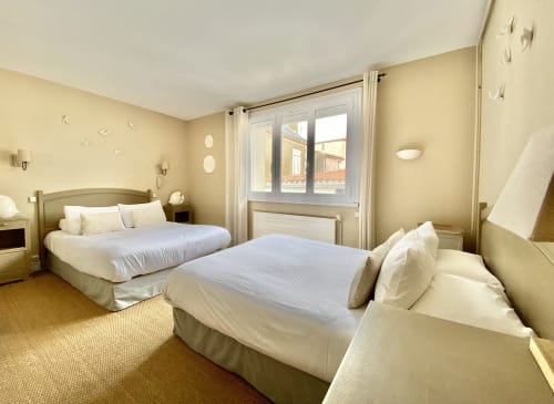 Twin beds in bright bedroom at Hôtel Maison Richet, Les Sables-d'Olonne with sea view and modern amenities