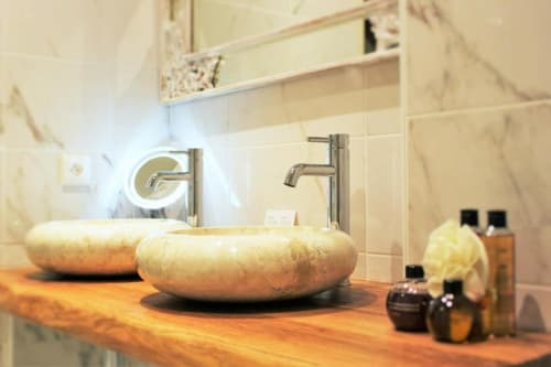 Two sinks of the bathroom with toiletries | Discover Sophistication in the Junior Suite Grand Cru