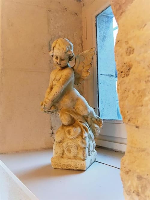 Figurine of an angel | Spacious and Elegant – The Family Loft Suite Awaits You