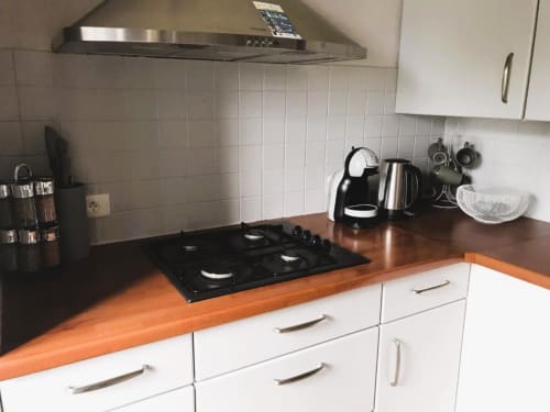 Kitchen area with appliances and stove | Spacious and Elegant – The Family Loft Suite Awaits You