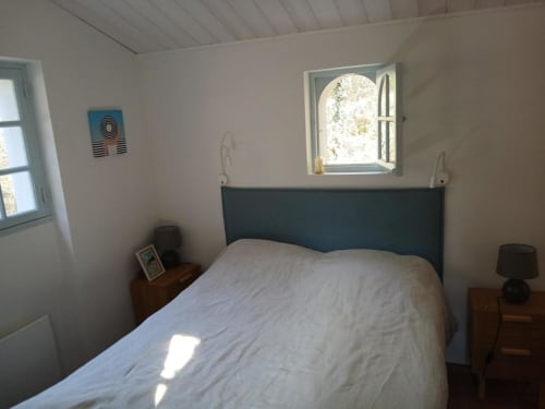 Comfortable bed with windows | Immerse Yourself in Serenity at The Pine Grove Setting