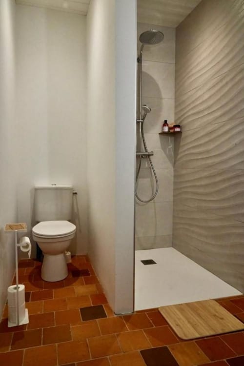 Bathroom with toilet and shower area | Immerse Yourself in Serenity at The Pine Grove Setting