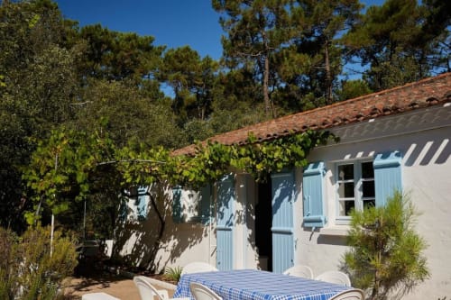 Outside view of the villa with table and chairs to relax | Immerse Yourself in Serenity at The Pine Grove Setting