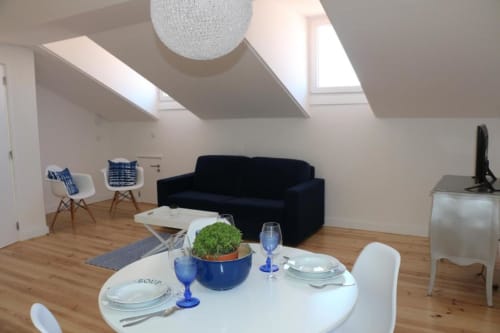 Living area with dining table | Experience Comfort and Style at Loving Chiado 1 in Lisbon

