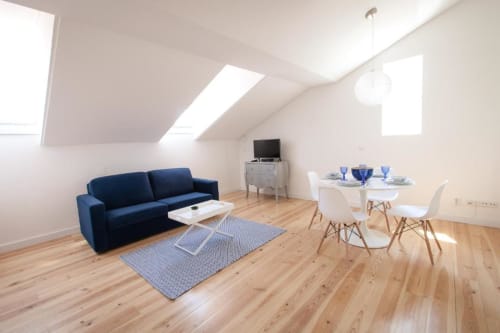 Living area with dining table | Experience Comfort and Style at Loving Chiado 1 in Lisbon

