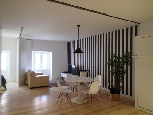 Living area and dining table with utensils | Relax and Unwind at Loving Chiado 2 – Your Perfect Lisbon Stay