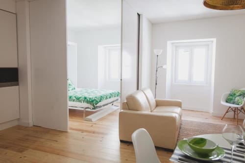 Bedroom, kitchen, and living area | Charming and Modern Living at Loving Chiado 4 in Lisbon
